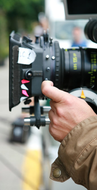 person filming with his camera