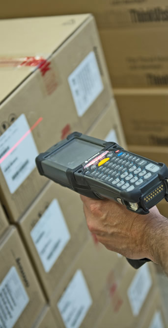 person scanning the parcel using a scanner